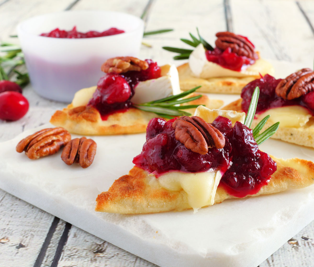 holiday snacks of bread, brie and cranberries