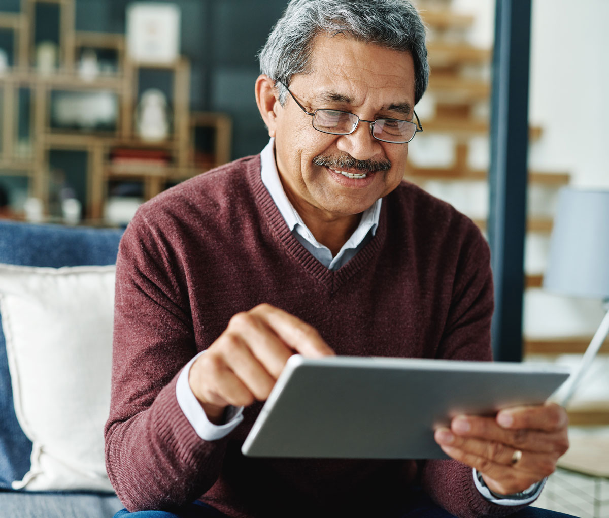 senior man on a tablet device
