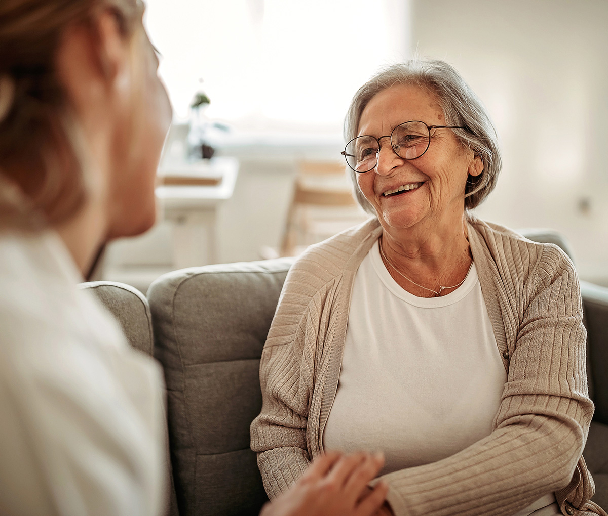 Female doctor consulting her senior patient