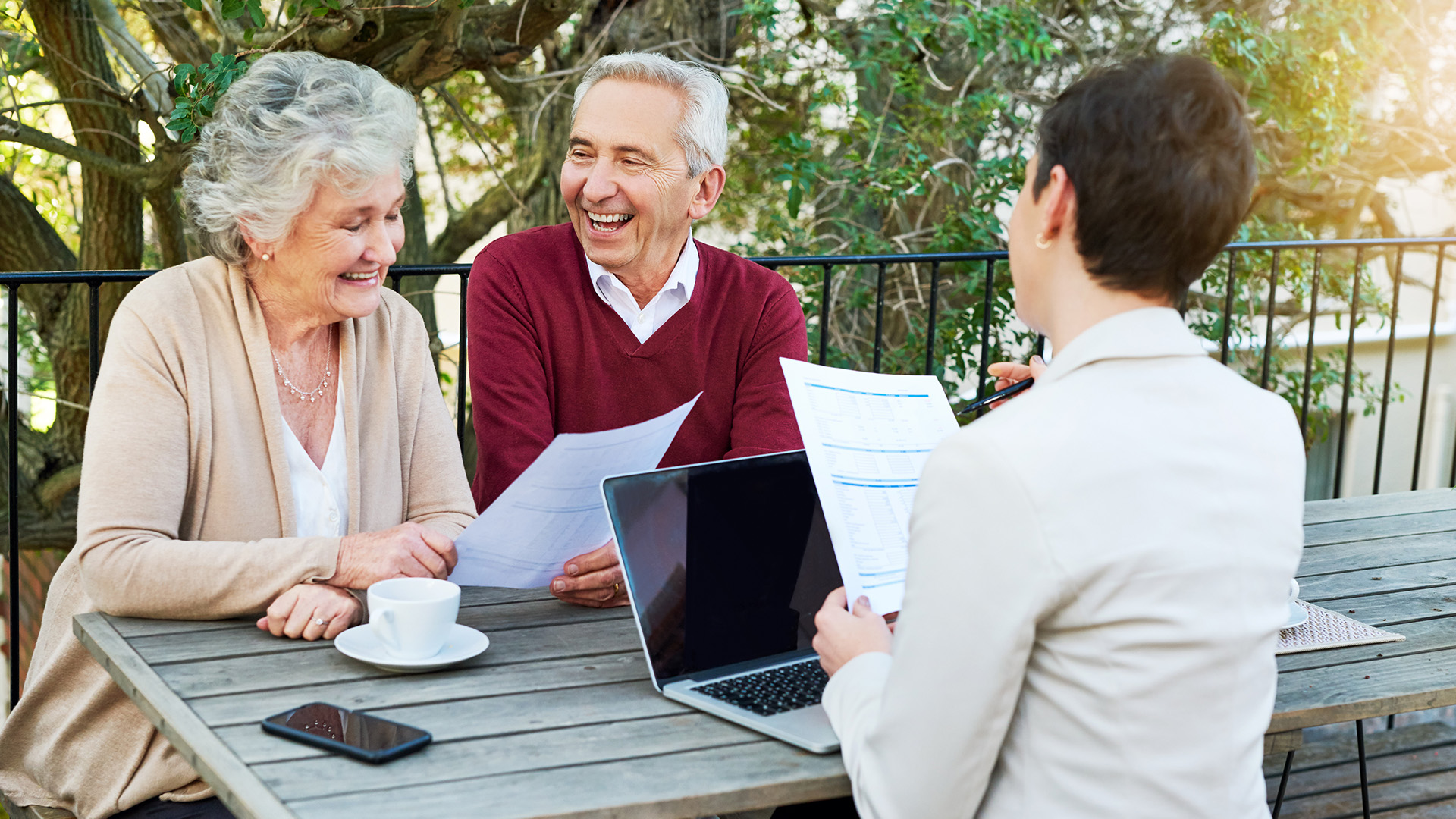 Cropped shot of a senior couple meeting with their financial planner outside